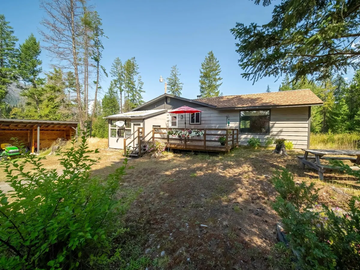 A modest home on a treed Kootenay acreage